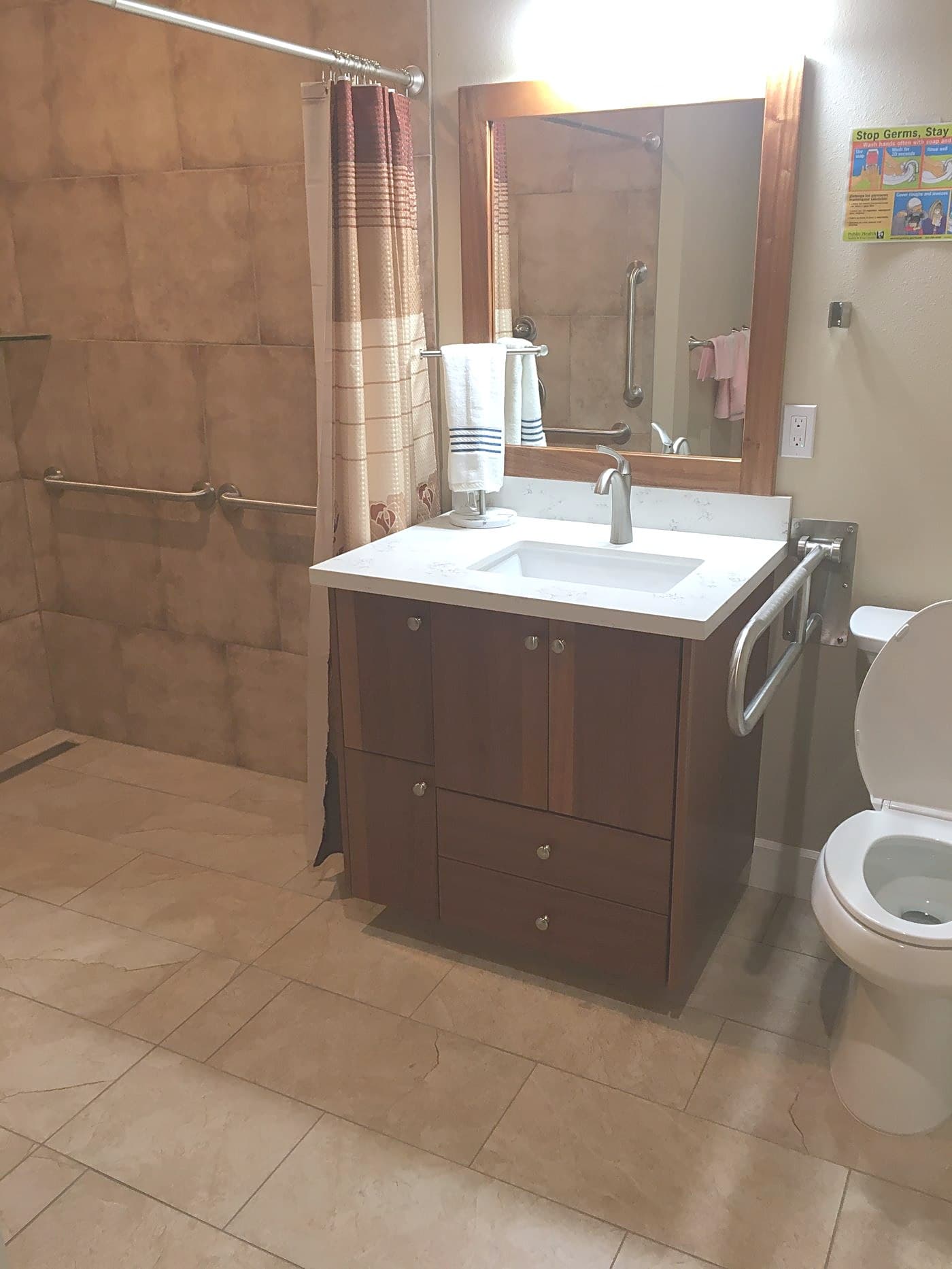 A clean private bathroom with vanity