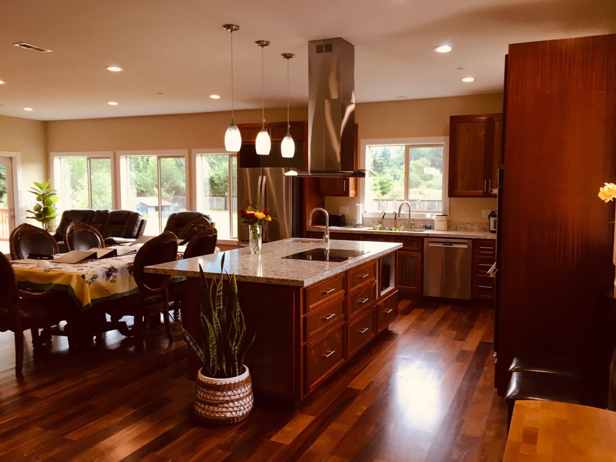 Bright, open living and dining area with hardwood floors