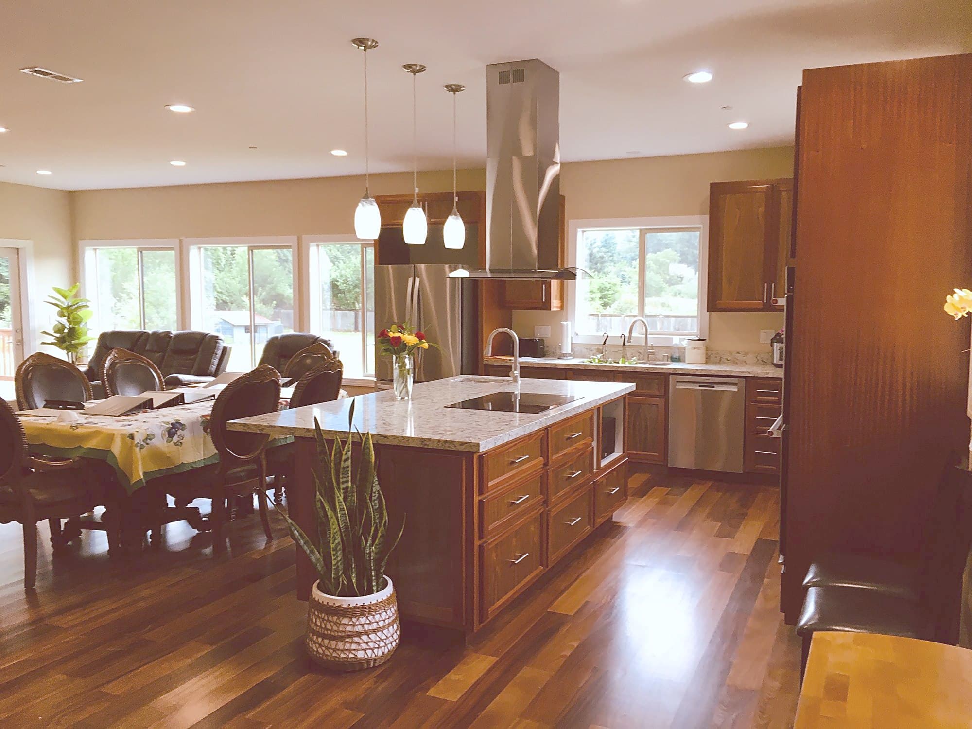 Bright, open living and dining area with hardwood floors
